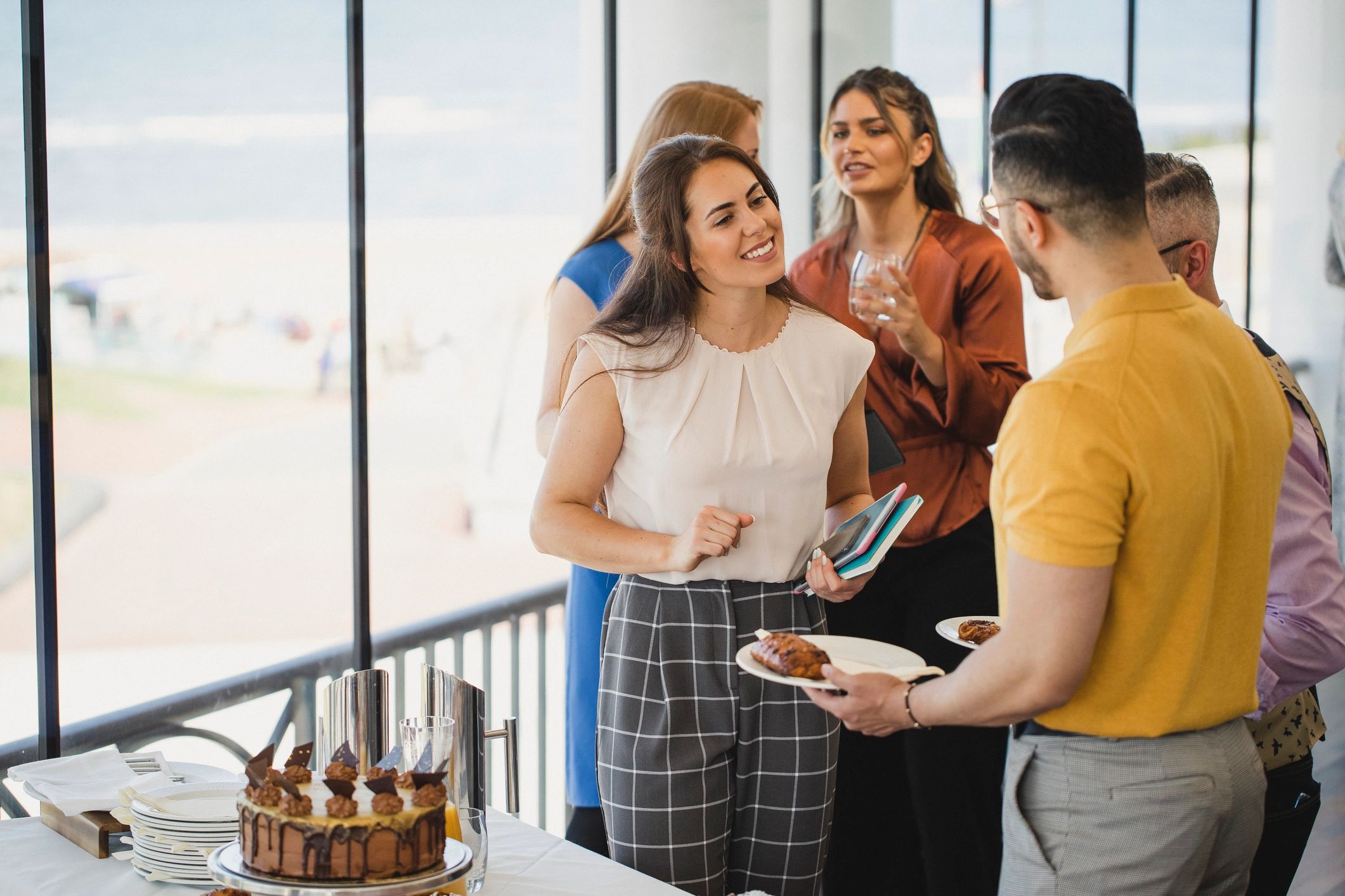Colleagues chatting at a corporate lunch event