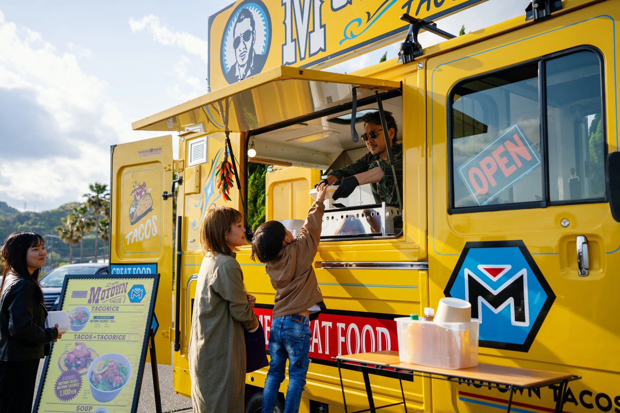 Family buying treats from an ice cream van