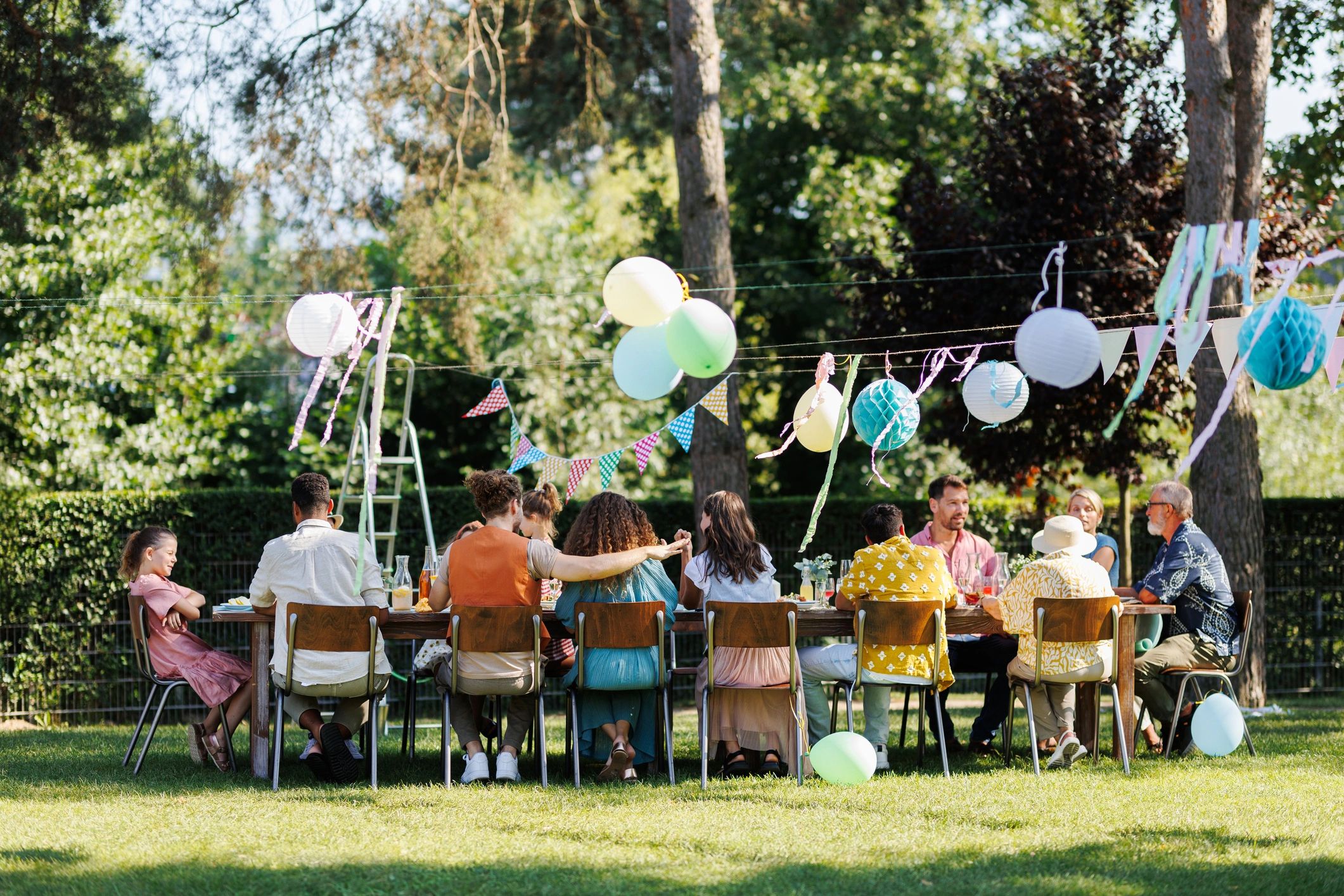 Friends and family seated together at an outdoor party