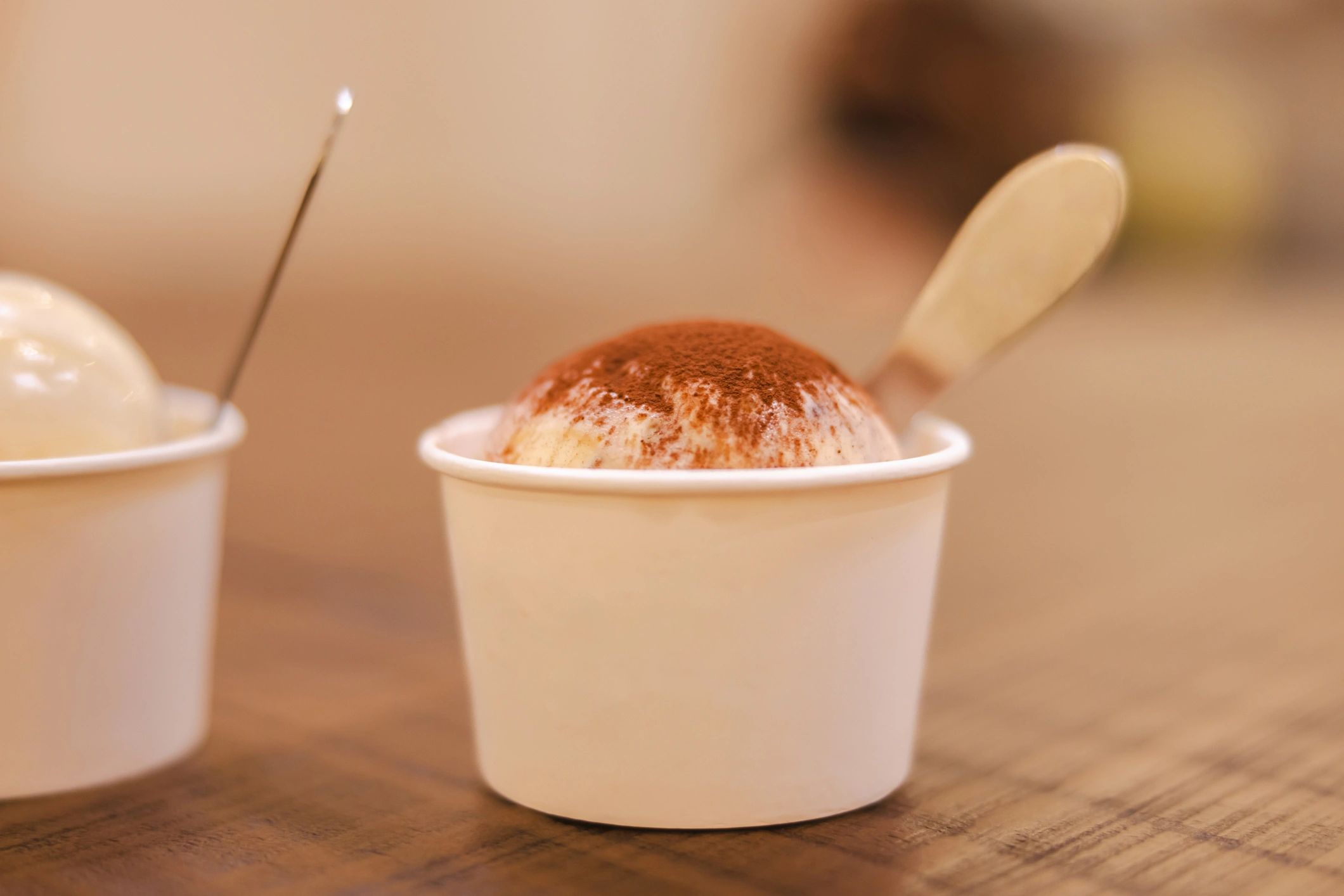 Tiramisu ice cream in a cup with spoon