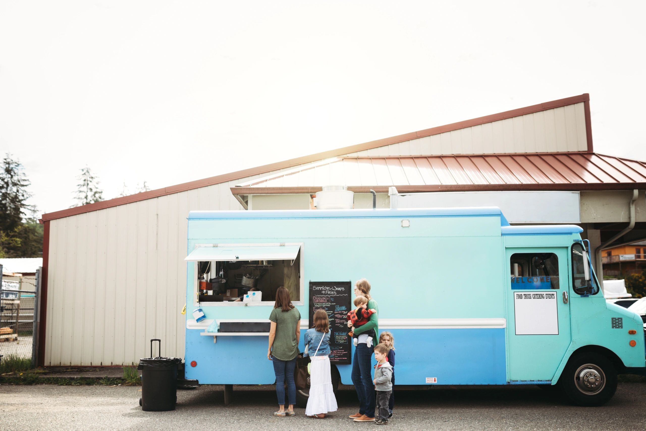 Group deciding what to order at a food cart